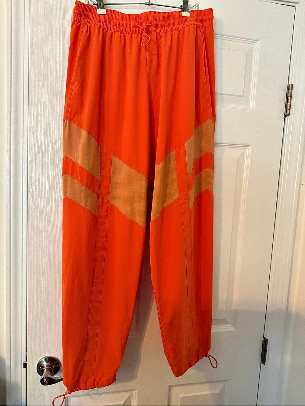 Outdoor Voices Geometric Track Pants in Orange & Brown Medium